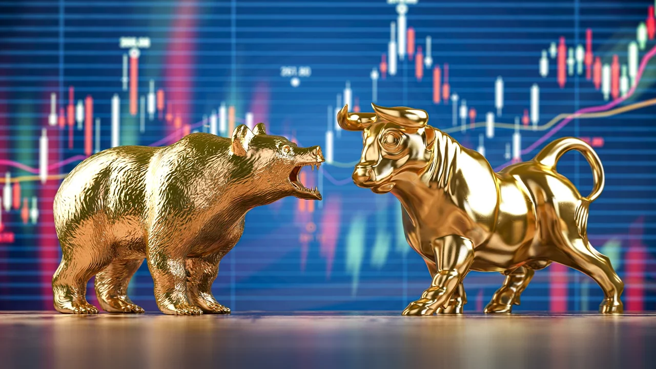 Imagem mostra touro e urso na frente de um gráfico fazendo alusão a bull market e bear market