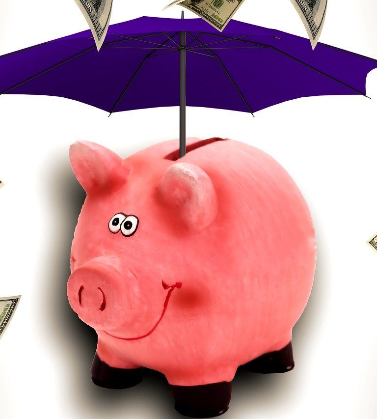 Imagem mostra guarda-chuva fazendo proteção (hedge) do dinheiro